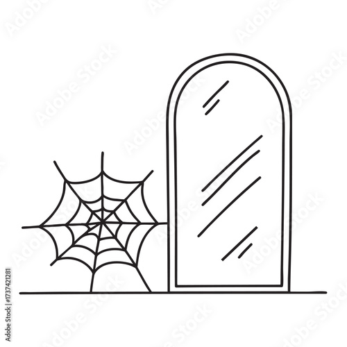 A web beside a cracked mirror leaning against the wall