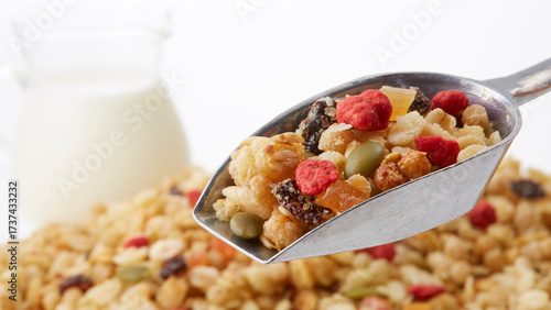 Fruit granola and milk on a white background
