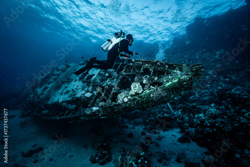 diver checking a small ship wreck in the Red Sea