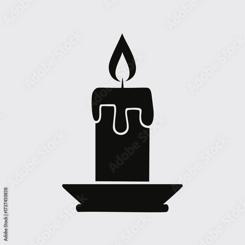 Black silhouette of a melting candle on a saucer dripping