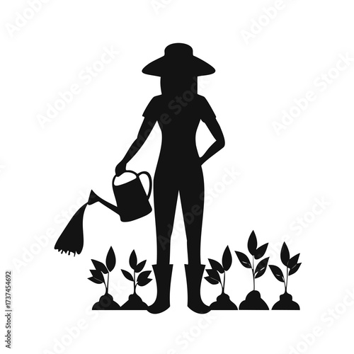 Silhouette of a woman tending to plants in a garden