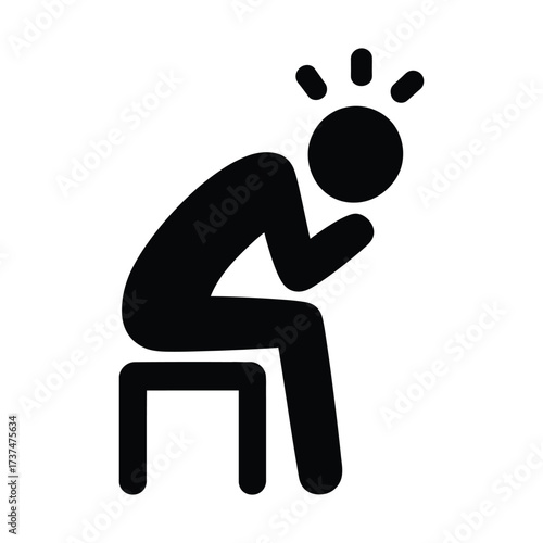 Silhouette of a person sitting with head in hands showing stress and despair
