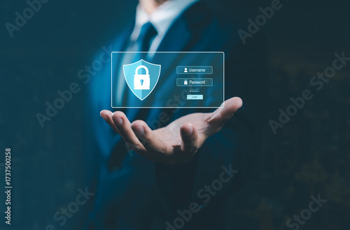 Businessman holding digital security login interface with username and password fields, symbolizing cybersecurity, data protection, online privacy, and secure access in modern technology.