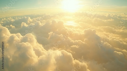 90.A mesmerizing skyscape at dawn, with fluffy white clouds stretching across the frame, illuminated by the warm glow of the rising sun. The deep blue sky transitions into vibrant shades of gold and