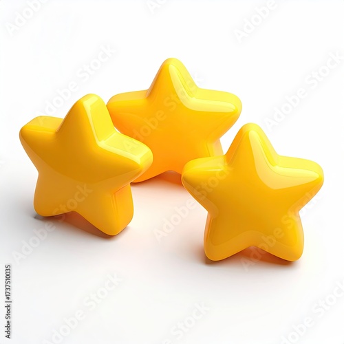 Three glossy yellow stars clustered on a white surface