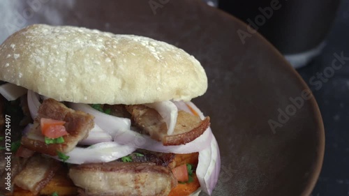 A very popular dish in Peru: Bread with pork rinds and a cup of coffee.