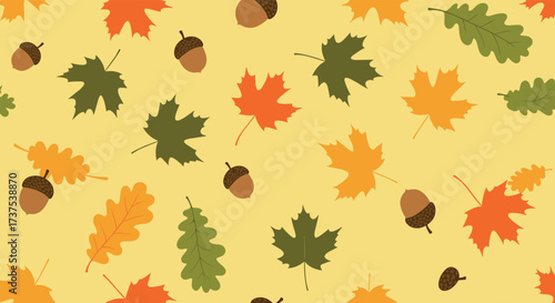 Autumn leaves and acorns scattered across a yellow background pattern.