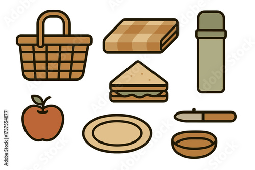 Picnic setup with basket, snacks, and drink container ready for outdoor enjoyment in a sunny park