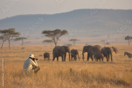 Wildlife Photographer Photographing a Herd of Elephants on African Safari