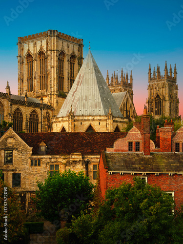 York city sunrise skyline after rain with York Minster cathedral and landmark houses and buildings, viewed from the City Walls in England