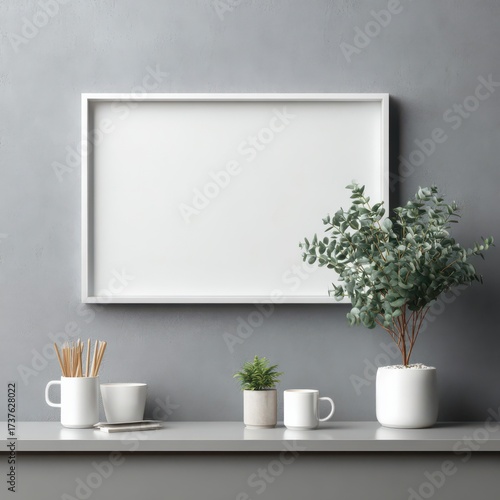 Wallpaper Mural Artistic Mockup: An empty picture frame rests above a minimalist desk, adorned with stylish decor, providing a fresh space for creative expression or artistic vision. Torontodigital.ca