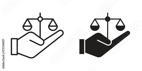 Justice scales in Hand icon art in black and white