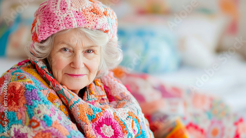 Expressive portrait of aged lady with kind eyes, adorned in intricate, vivid crochet hat and shawl, embodying sense of gentle comfort and cheerful spirit.