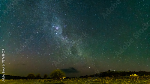 The Milky Way Night Sky with a hint of the Aurora over the countryside