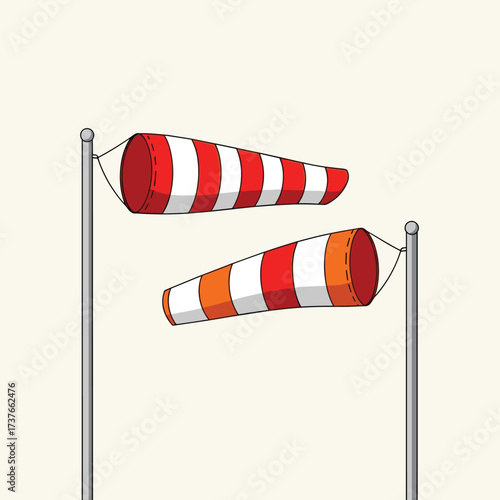 Two striped wind socks showing different wind directions and speeds on poles.