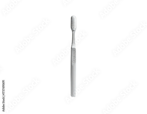 A minimalist, white toothbrush stands upright against a stark black background