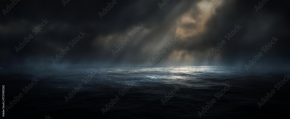 Obraz premium Dramatic Ocean Scene with Stormy Sky and Light Rays.