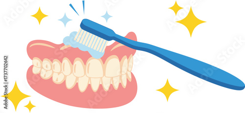 Sparkling clean dentures being brushed with toothpaste and a toothbrush, symbolizing oral hygiene.