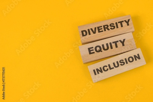 Wooden Blocks With Words Diversity, Equity, Inclusion Isolated On Yellow Background