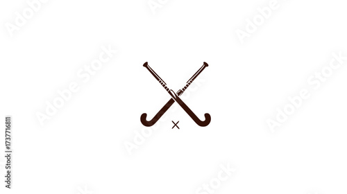 Minimalist design featuring two brown field hockey sticks crossed over an 'X' symbol, isolated on a clean white background, representing sport and game.