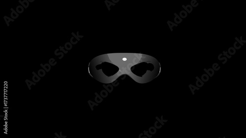 Sleek dark superhero eye mask with a white dot detail on a black background, representing anonymity and mystery.