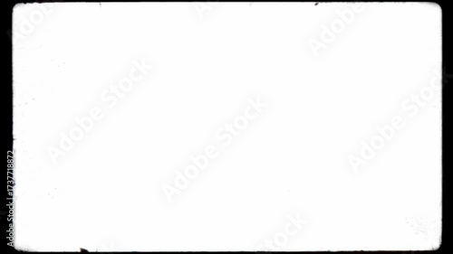 Vintage 8mm or 16mm film frame border with rounded corners, dust, and scratches. Seamless loop on a white background for use as a luma matte or overlay to create a retro cinematic look