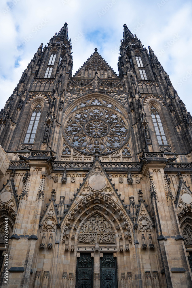 Fototapeta premium Stunning sunrise over Prague with warm golden light illuminating historic architecture, cobblestone streets, and iconic city landmarks in high-quality detail.