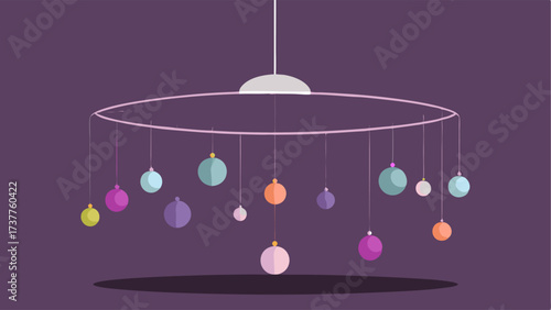 A mobile made of metal wire and beads hangs from the ceiling creating a mesmerizing and everchanging piece of art.
