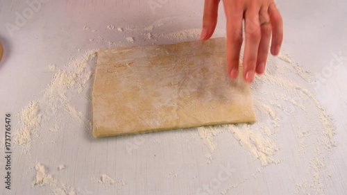 Woman hands baker cooking rolling and folding dough for perfect pastry on kitchen. Create delicious healthy food. Cuisine culinary prepare homemade cook dish domestic healthy meal recipe ingredients.