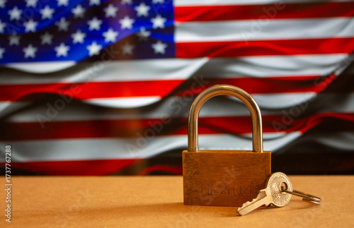 Photography Locked padlock on the right with a US flag in the background, government shutdow