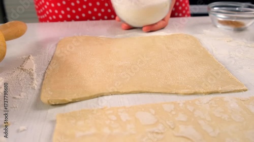 Pastry chef woman sprinkling sugar over fresh dough on kitchen cooking dessert. Create delicious healthy food pastry. Cuisine culinary prepare homemade cook domestic meal baking recipe ingredients.