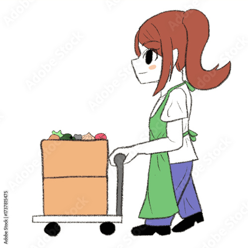 段ボール箱に入った野菜を台車で運んでいるエプロンを着た女の子