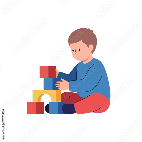 A young boy sits on the floor, intently stacking colorful building blocks to create a tower, engaging in creative play.