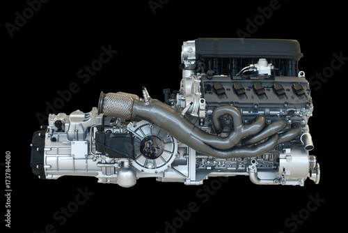 This high-performance V-type engine features a complex exhaust manifold, precision-machined components, and a compact layout, designed for maximum power output