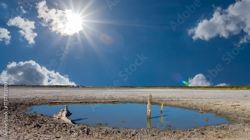  small puddle among saline land under the hot summer sun time lapse scene