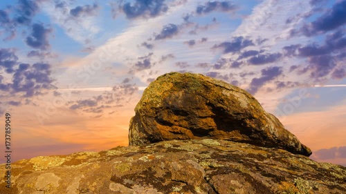  heap of huge stones at the sunset time lapse scene