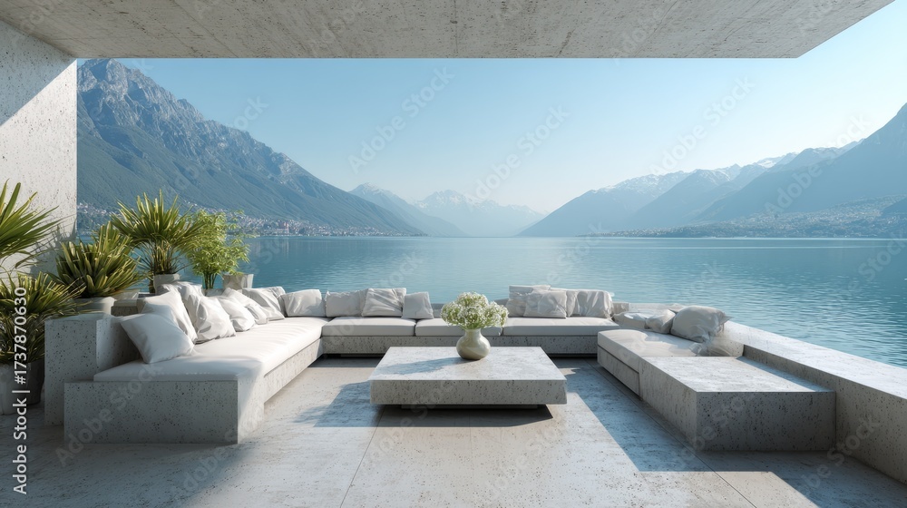 Fototapeta premium Beautiful outdoor terrace with modern lounge furniture, coffee table, and green plants, overlooking calm mountain lake landscape