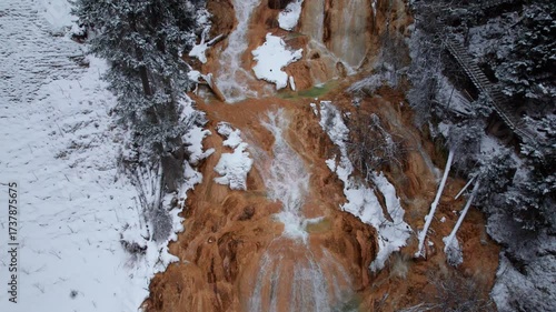 Wallpaper Mural Drone view of Zhaga waterfall in Mounigou in Songpan, Sichuan, China. Beautiful waterfall with snow covered pine forest in winter day. 4k real time footage travel concept. Torontodigital.ca