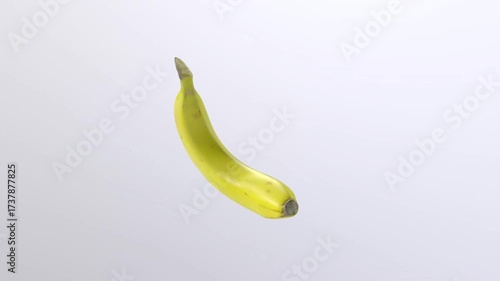 Fresh Yellow Banana Rotating in Mid air on a White Backdrop