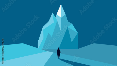 Person walking towards a mountain peak
