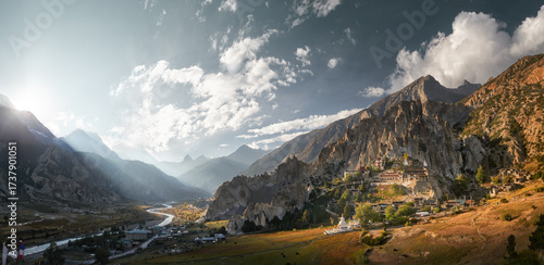 Panoramic view of ancient village of Bhraka and valley with Marsyangdi River flowing along northern slopes of Annapurna Himalayas, Nepal.