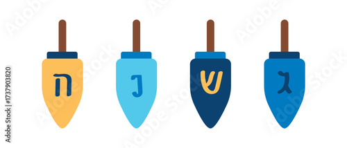 Set of wooden dreidels. Wooden spinning tops with Hebrew letters