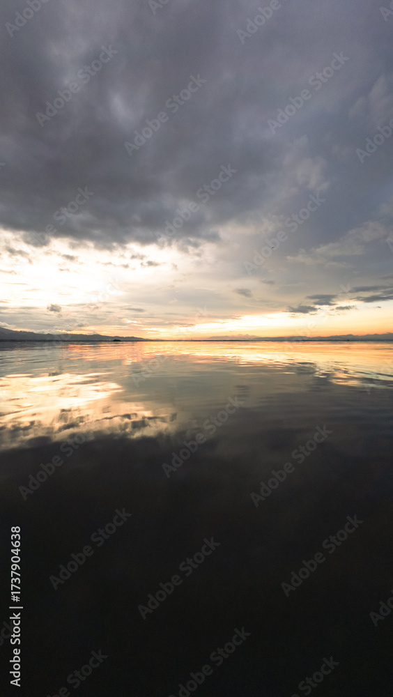 Fototapeta premium Scenic View of Calm Ocean at Sunset