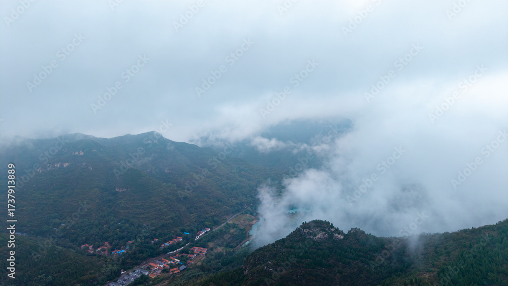 Fototapeta premium Aerial view of mountains in autumn mist