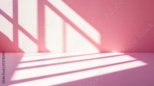 A cozy room with a pink accent wall and white floor