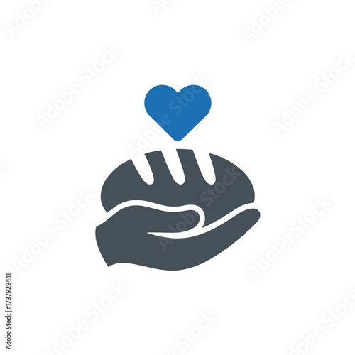 Hand holding bread with heart, symbol of charity, donation, and food bank for people in need