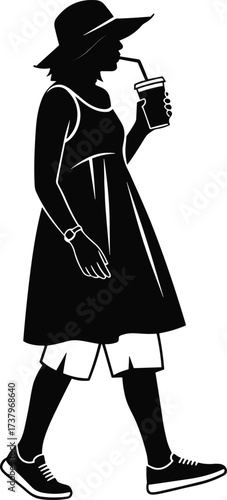 Stylish woman walking outdoors in summer dress and hat, sipping drink through straw, casual fashion silhouette, urban stroll, relaxed lifestyle, modern female figure