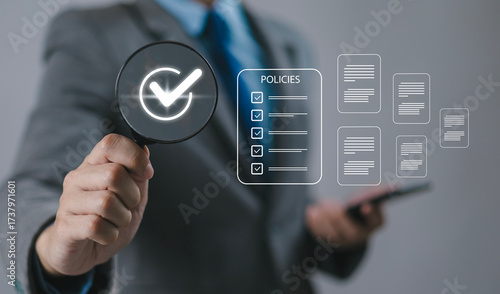 Businessman reviews company policies, digital documents, ideal for policy management, business compliance, document approval, and corporate governance visualization.