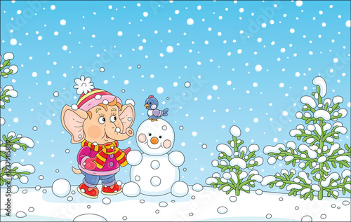 Cute little elephant playing with a merry small bird and making a funny toy snowman on a winter walk in a beautiful snowy park, vector cartoon illustration