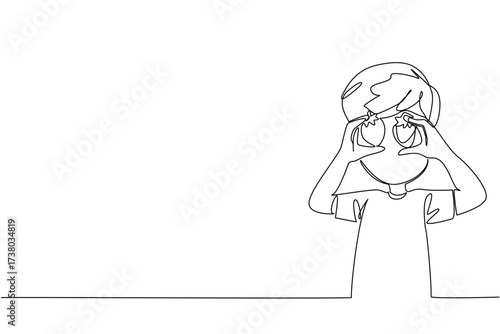 Continuous one line drawing a boy holds strawberry in both hands and puts it in front of eyes. Telling about favorite fruit. National Pick Strawberries Day. Single line draw design vector illustration